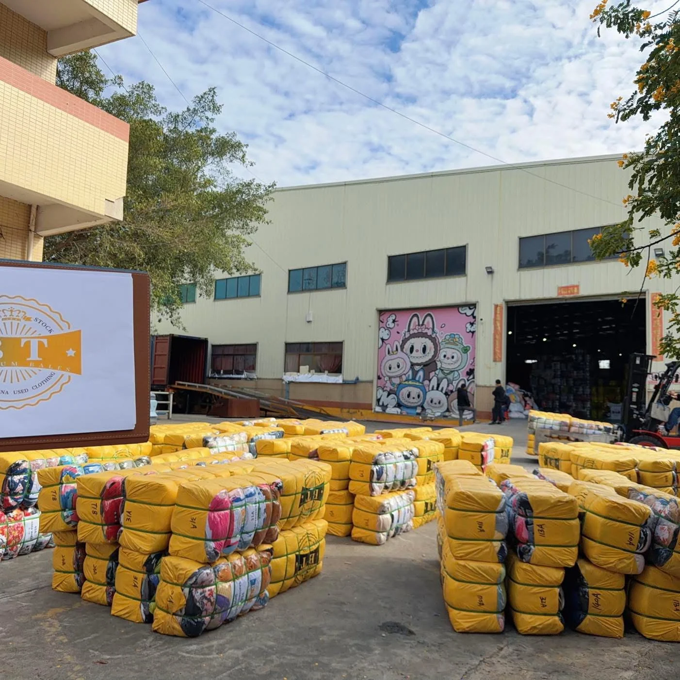 Guangzhou Bote factory yard with packed used clothes bales